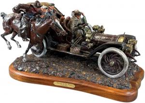 Hand-painted polychrome bronze sculpture by Stanley Wanlass (American, b. 1941-) depicting an early touring car overtaking a man on horseback, circa 1930, from an edition of 30. Sold for $34,800