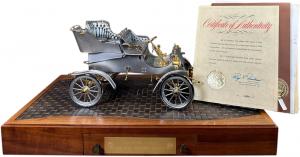 Official 75th Anniversary commemorative scale model of the 1903 Model A Ford, produced in 1978, in an edition of 1,708, by the American Silversmiths Guild for Ford Motor Company. Sold for $9,000