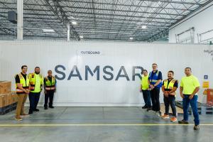 The Samsar team with outboard remanufactured EV batteries that have been tested and certified for reuse