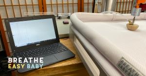 Breathe Easy Baby™ crib mattress undergoing scientific testing with monitoring equipment in a testing lab