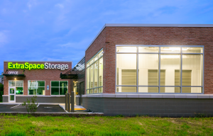 A twilight image of DXD Capital's Richmond self storage facility. The photo is straight shot of the office from the parking lot.