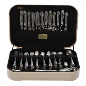 167-piece sterling silver flatware set by Heirloom Sterling in the Damask Rose pattern, the total sterling weight 5,035 grams (excluding items with stainless blades). Estimate: $9,000-$11,000