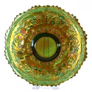 Green carnival glass Peter Rabbit plate by Fenton, an outstanding example that would complement any collection, 9½ inches in diameter. Estimate: $2,500-$4,000