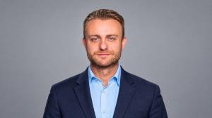 Professional headshot of Gino Veneroso, Area Sales Manager at TheKey and CMSA-NYC board member.