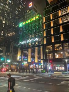 TD Garden and North Station glow green at night in recognition of International Myotonic Dystrophy Awareness Day.