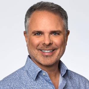 Professional headshot of CJ Kerls, Branch Manager and SVP of Mortgage Lending at Rate.