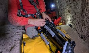 Explorer preparing a CHASING M2 PRO MAX underwater ROV inside the narrow Raja Santa cave.