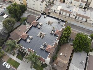 Aerial view of a completed flat-roof project by The Affordable Roofers