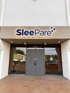Illuminated SleePare sign above the entrance to the Seattle showroom at 5701 6th Ave S