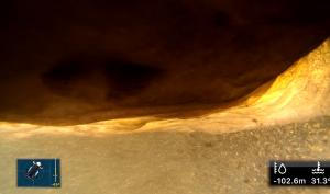 Underwater view from a CHASING M2 PRO MAX at 102.6 meters depth inside Raja Santa Cave, showing confined rock formations and a water temperature of 31.3°C.