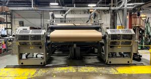 Webco paper rewinder running a kraft paper roll on the Paper Dimensions production floor