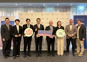 Eight representatives pose at the 15th anniversary celebration of China Airlines’ SkyTeam membership, holding China Airlines, SkyTeam, and “Celebrating 15 Years and Beyond” signs.
