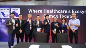 Speakers and delegates in front of the forum backdrop.