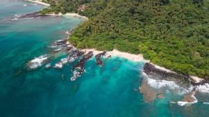 Aerial view of the lush tropical coastline and clear turquoise waters of São Tomé and Príncipe, the destination for the new $90,000 Citizenship by Investment program.