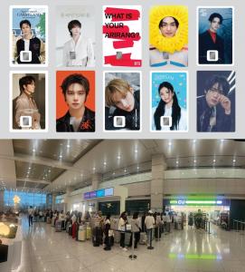 NAMANE K-pop themed cards and global travelers at an airport in Korea.