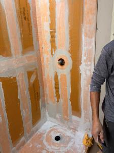 Kerdi shower waterproofing in Venice FL with banded seams, sealed valve penetration, and Kerdi shower pan before tile installation