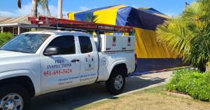 ER Pest and Termite service truck sits in front of a San Bernardino County, CA home tented for termite fumigation.