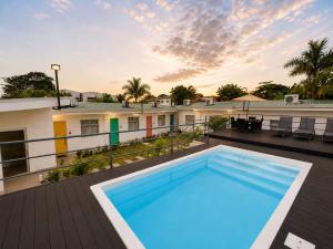 Swimming pool and garden courtyard at Jaco Living short-term rentals in Jacó, Costa Rica.