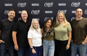 Rachael Lampa and Centricity Music’s leadership team are pictured (l-r) during a signing event: Matt Ewald, VP, A&R; John Stokes, Sr. VP, Mktg & Ops; Caren Seidle, CEO; Lampa; Camy McArdle, Co-GM/Sr. VP, Business Affairs & Publishing; Chad Segura, Sr. VP, Publishing.