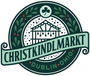 Christkindlmarkt Dublin logo with a holiday market hut, shamrock, botanical greenery, and “Dublin • Ohio” in a circular design.