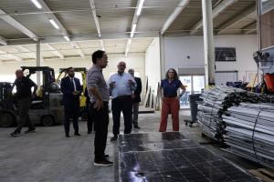 Senator Andy Kim views separated PV aluminum and glass waiting for downstream recycling