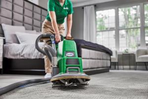 Eco Valley Chem-Dry technician providing professional carpet cleaning in a Calgary home