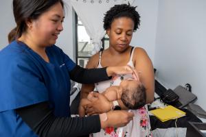 A VNS Health NFP nurse makes a home visit to one of her NFP clients and her infant child
