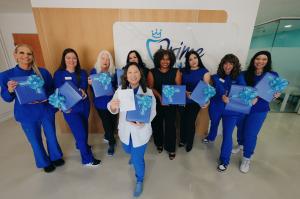 Dr. Sarah Kym, DDS and her Tucson, AZ team, celebrating Prime Dental's 7-year anniversary