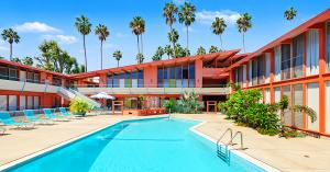 Pool at the Hollywood Riviera with views of the mid-century building designed by architect Edward Fickett.
