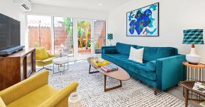 Living room showcasing mid-century details with views to a private patio.