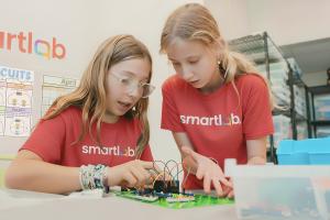Students collaborate while completing a hands-on circuitry project in a SmartLab, building STEM skills through career-connected learning.