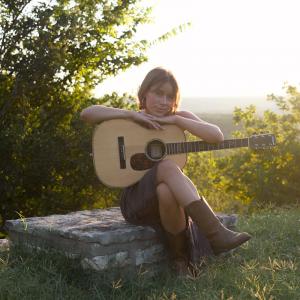 Morgan Perry posing with guitar in nature. “You’re So Vain” singer Morgan Perry poses with guitar in a nature photo (Courtesy Morgan Perry)
