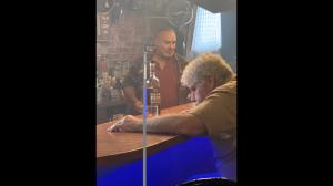 Actor Ron Perlman on the set of "We Could Be Heroes" with Broadstreet Infamous Prohibition Proof bourbon, which is featured in the upcoming film.