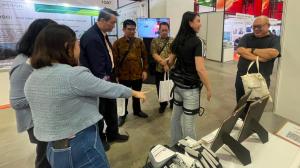 Kerry Guo walking while showcasing the GoGo exoskeleton