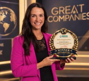 Lori Werner accepts marketing award for Medical Marketing Whiz