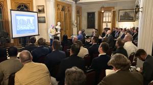Justin Shubow speaks on classical architecture at a podium inside the Belmont Mansion in Nashville, Meriwether Academy