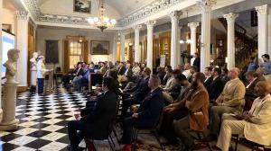Sold-out audience seated in the Belmont Mansion atrium for Meriwether Academy's Justin Shubow lecture