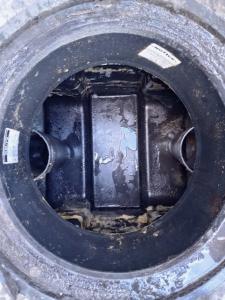 Clean commercial grease trap following successful pumping and removal of accumulated grease and solids.