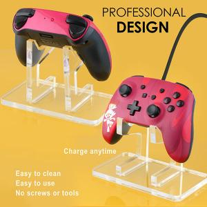 A great contrast color concept of the red gaming console on a transparent holder put on a yellow backdrop. Done by EtherArts Product photography Atlanta.