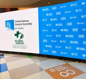 United Nations General Assembly 81st Session display with Global Green Healthy People, Healthy Planet™ branding and Sustainable Development Goals backdrop.