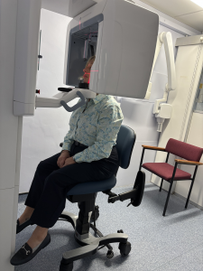 Close view of the VELA CBCT Chair with armrests and backrest supporting a seated patient