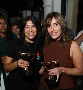 Assemblywoman Alixon Collazos-Gill, left, and Senate Majority Leader M. Teresa Ruiz hold their Unity Table awards at Todos a la Mesa.
