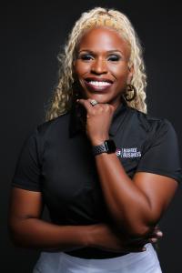 Bri Simpson, Executive Director and CEO of Barred Business seen in her professional headshot.