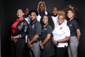 Bri Simpson, Executive Director and CEO of Barred Business pictured with members of her staff.