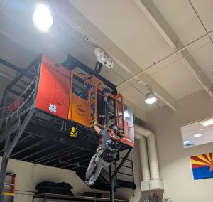 USCG student completing hoist training on P1AR's hoist tower.
