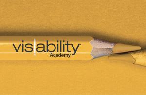 The vis/ability Academy logo, superimposed over a yellow pencil.