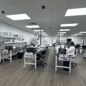 Interior of TruMo Analytics’ cannabis testing laboratory in Strafford, Missouri, showing multiple lab testing stations, scientists working at benches.