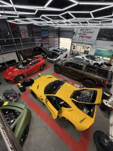 Custom Wrap Design garage full of customized cars