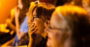 Audience watching "Something Spooky" have their mouths covered. They are getting goosebumps.