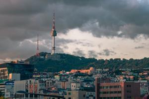 A panoramic view of the Seoul skyline featuring N Seoul Tower